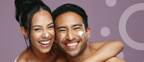 Two people with a product on their faces against a purple background