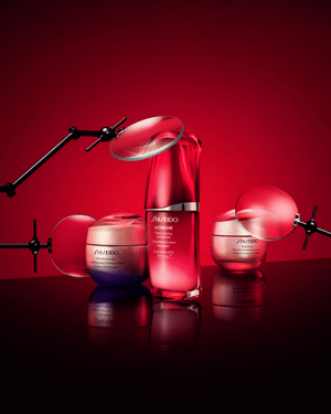 Shiseido skincare products on a red background