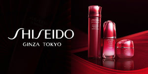 Shiseido skincare products on a red background with the Shiseido logo.