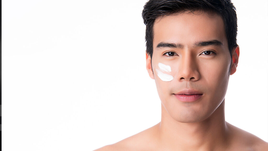 sunscreen on mans cheek
